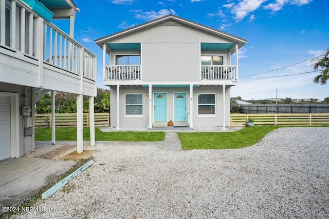 back of house with a balcony