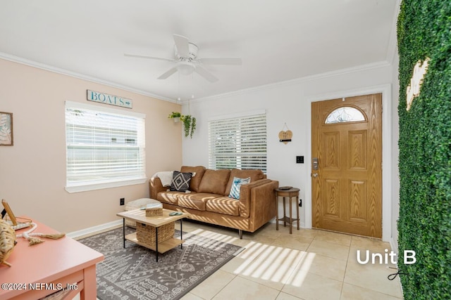 tiled living room with ornamental molding and ceiling fan