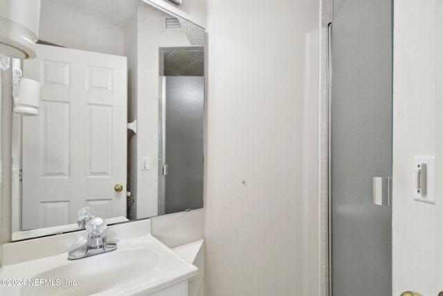 bathroom with vanity and an enclosed shower