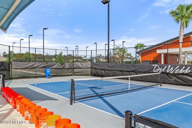 view of sport court with basketball hoop