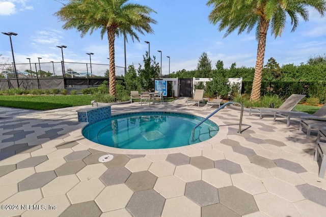 view of swimming pool featuring a patio