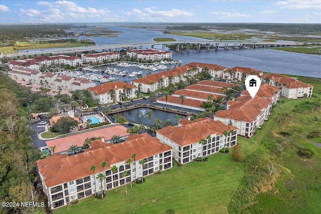 birds eye view of property with a water view