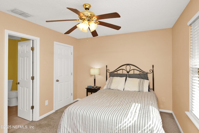 bedroom featuring ceiling fan and light carpet