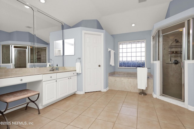 bathroom with vanity, vaulted ceiling, and shower with separate bathtub