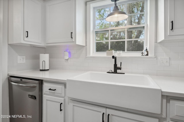 kitchen with white cabinets, dishwasher, backsplash, and decorative light fixtures