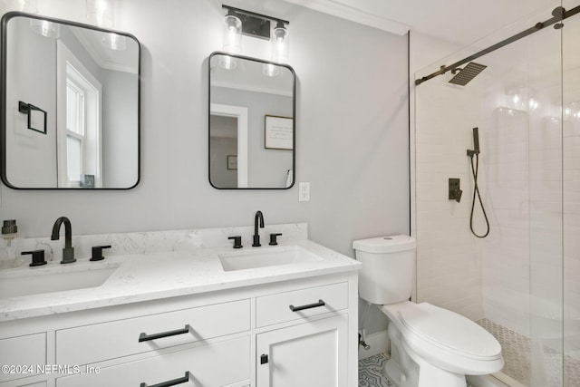 bathroom with a shower with door, vanity, and toilet