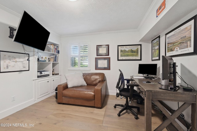 office area featuring light hardwood / wood-style flooring, a textured ceiling, and ornamental molding