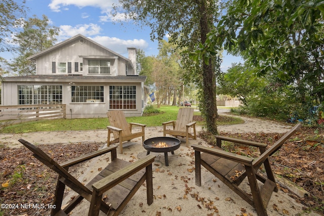 exterior space featuring a patio and a fire pit