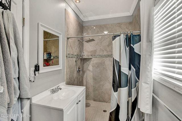 bathroom featuring vanity, a shower with shower curtain, and crown molding