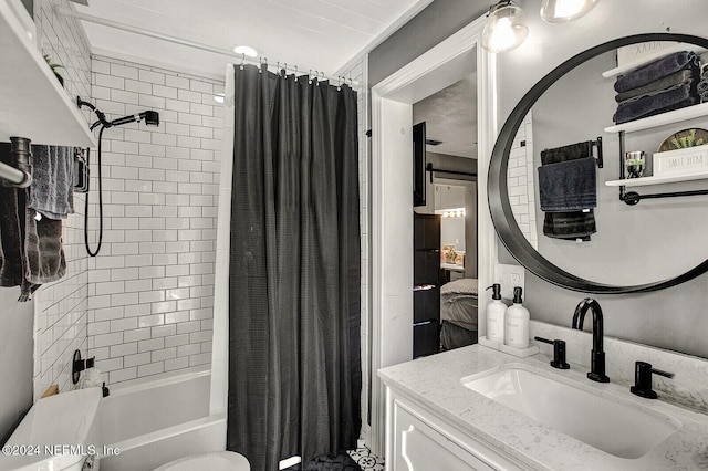 full bathroom with toilet, vanity, and shower / bath combination with curtain