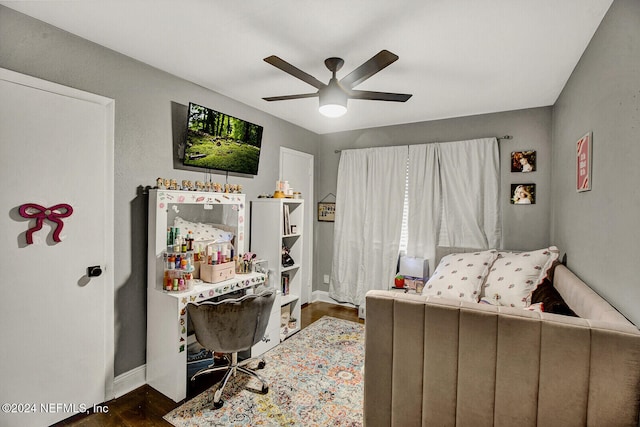 bedroom featuring dark hardwood / wood-style flooring and ceiling fan