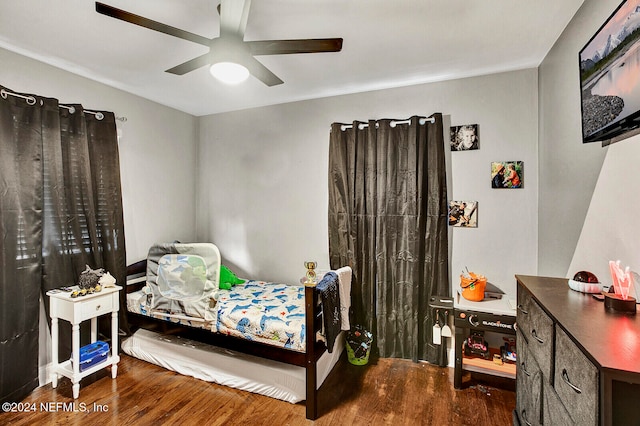 bedroom featuring hardwood / wood-style flooring and ceiling fan