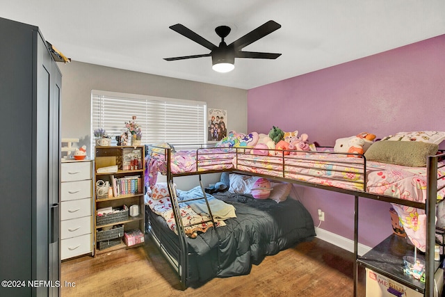 bedroom with hardwood / wood-style flooring and ceiling fan