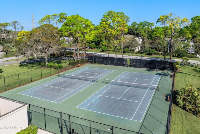 view of sport court with basketball court and a yard