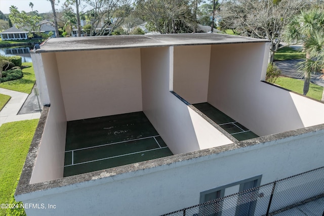 view of storm shelter with a water view