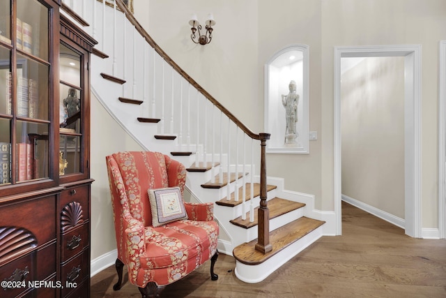 stairway featuring wood-type flooring