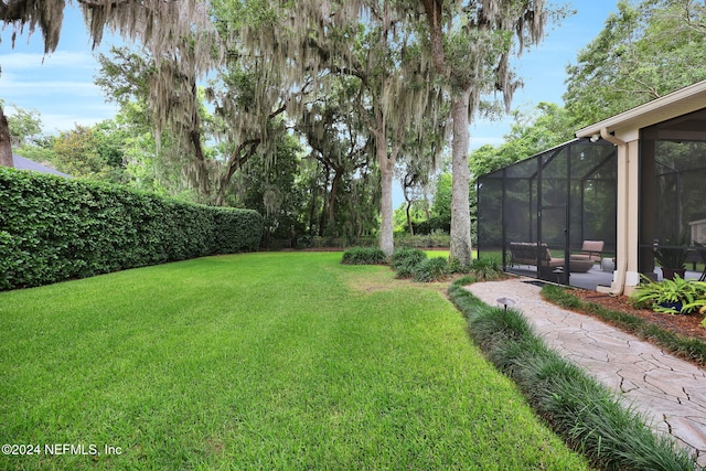 view of yard featuring a lanai and a patio