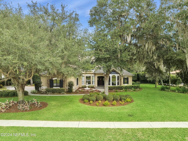 view of front of home with a front yard