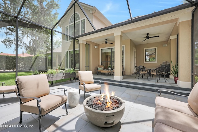 exterior space featuring outdoor lounge area, ceiling fan, and a lanai