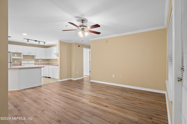 unfurnished living room with light wood-type flooring, sink, ceiling fan, and crown molding