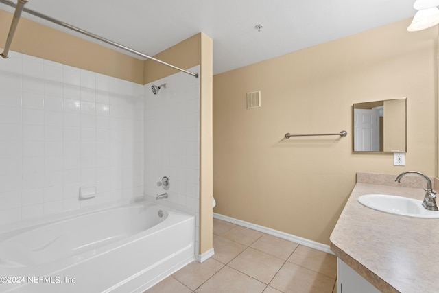 full bathroom featuring toilet, vanity, tiled shower / bath, and tile patterned floors