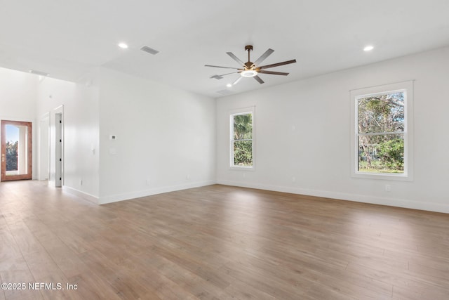 empty room with light wood-type flooring, visible vents, recessed lighting, baseboards, and ceiling fan