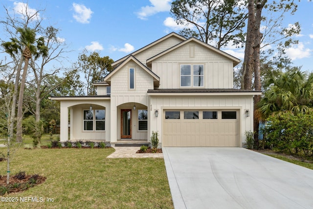 view of front facade with a front lawn, an attached garage, board and batten siding, and driveway