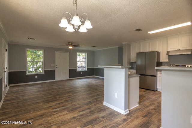 kitchen featuring ornamental molding, white cabinets, stainless steel fridge, and dark hardwood / wood-style floors