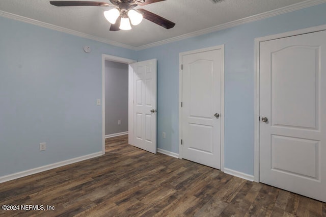 unfurnished bedroom with dark wood-type flooring, ceiling fan, a textured ceiling, and ornamental molding