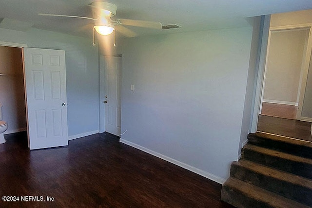 unfurnished bedroom with dark wood-type flooring and ceiling fan