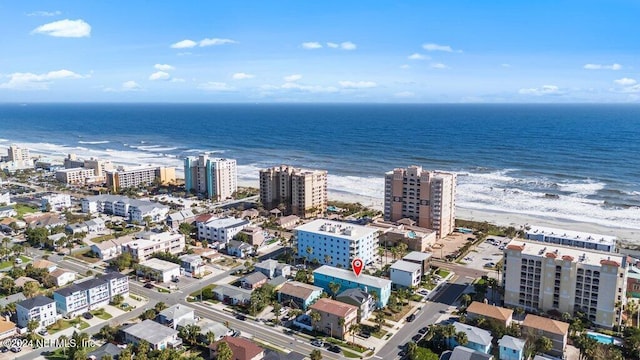 aerial view featuring a view of the beach and a water view