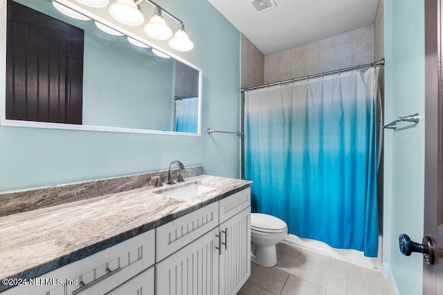 bathroom featuring vanity, a textured ceiling, tile patterned flooring, curtained shower, and toilet