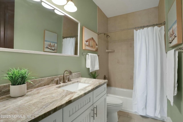 bathroom featuring toilet, shower / tub combo with curtain, vanity, and tile patterned flooring