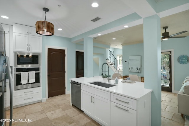 kitchen featuring visible vents, open floor plan, recessed lighting, stainless steel appliances, and a sink