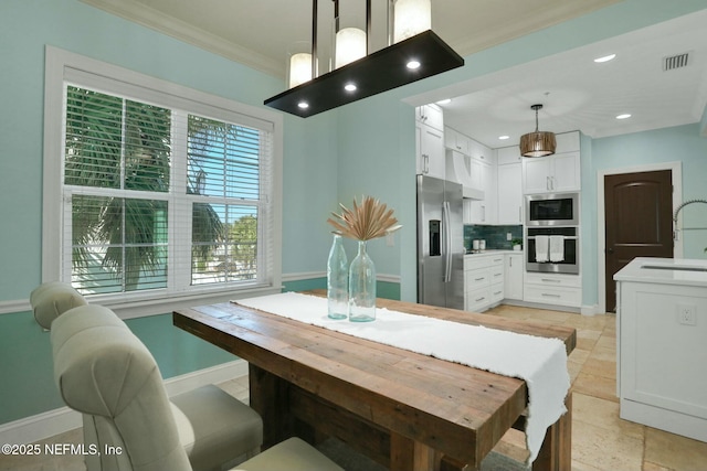 dining space with visible vents, ornamental molding, stone tile floors, recessed lighting, and baseboards