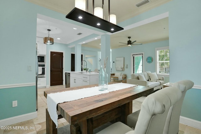 dining room with a ceiling fan, visible vents, baseboards, recessed lighting, and crown molding