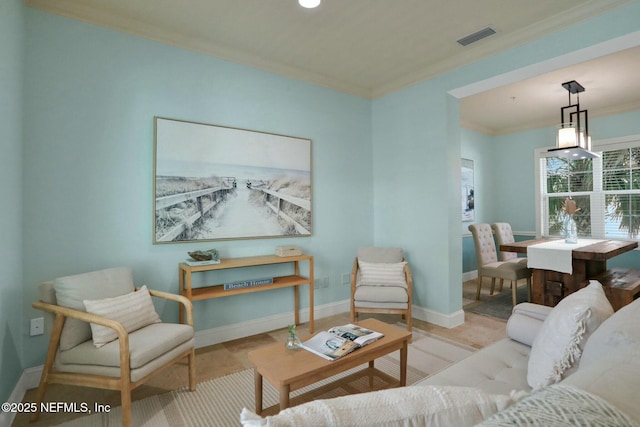 living area featuring visible vents, crown molding, and baseboards