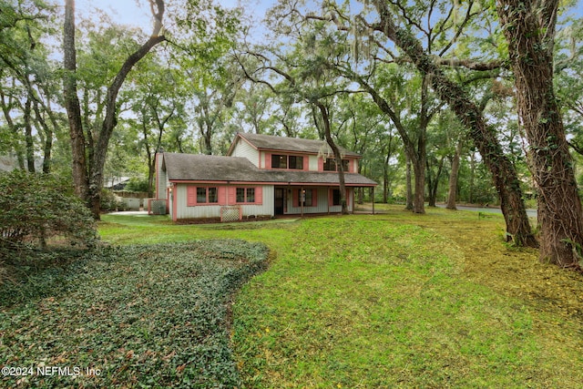 view of front of house featuring a porch and a front lawn