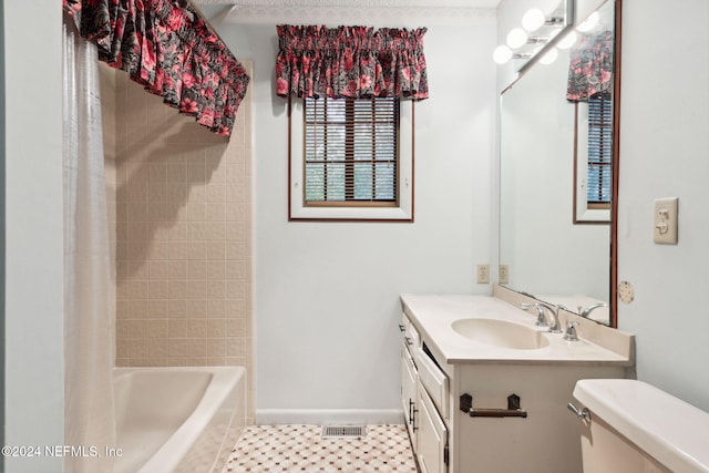 full bathroom with shower / bath combo with shower curtain, vanity, and toilet