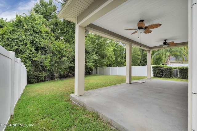 view of yard featuring a patio area, ceiling fan, and a fenced backyard