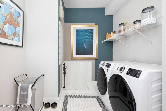 washroom with tile patterned flooring and independent washer and dryer