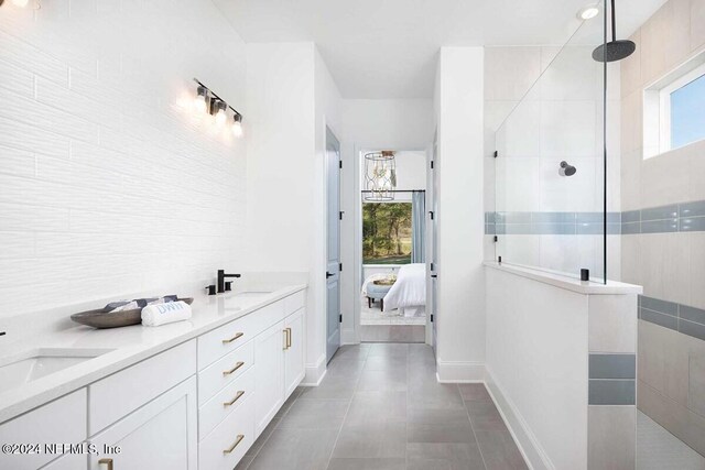 55 Sparrow Crk Dr, Saint Augustine, FL 32092 - ensuite bathroom with healthy amount of natural light, a walk in shower, and baseboards