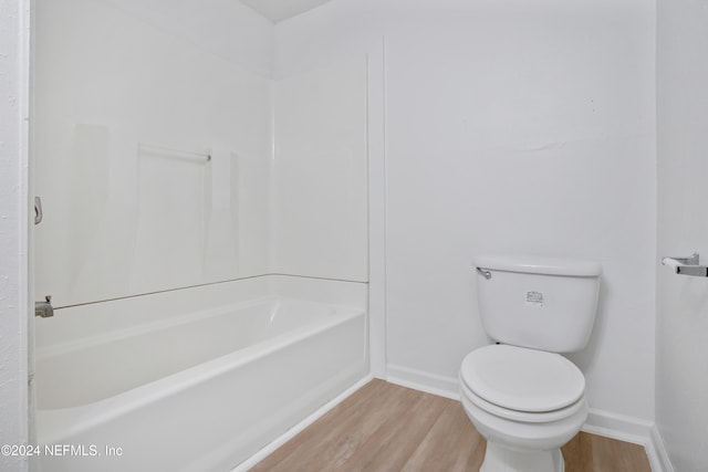 bathroom featuring toilet and hardwood / wood-style flooring