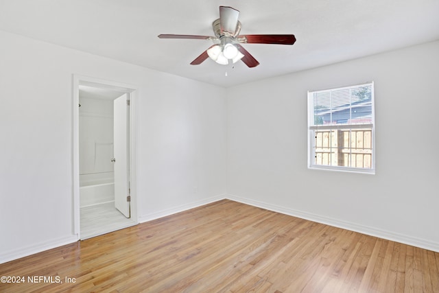 unfurnished room with ceiling fan and light hardwood / wood-style floors