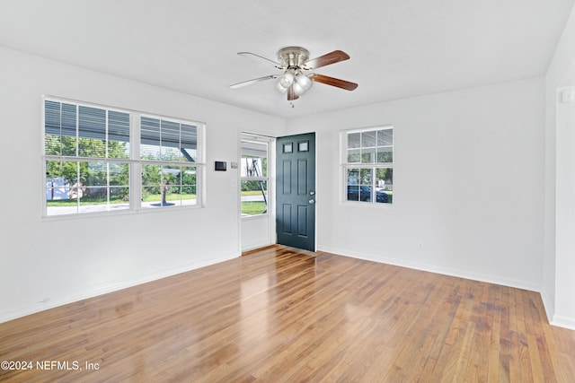 entryway with light hardwood / wood-style flooring and ceiling fan