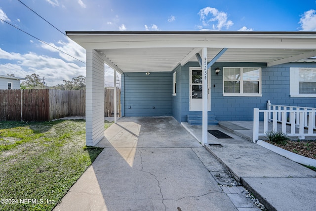 exterior space featuring a carport