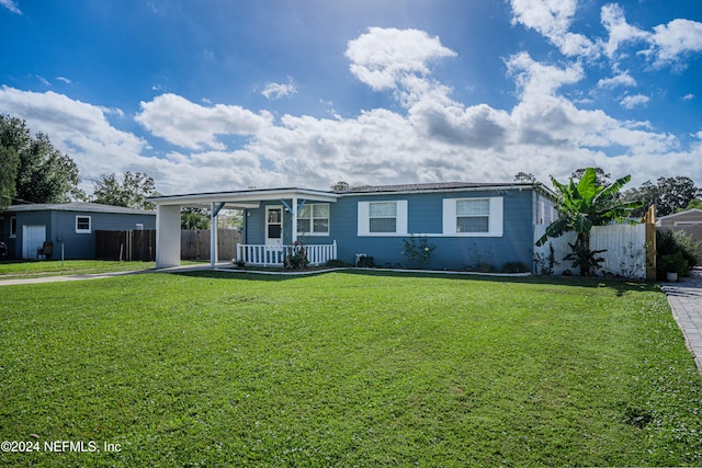 ranch-style home with a front yard