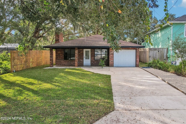 view of front of home with covered porch, a garage, and a front yard