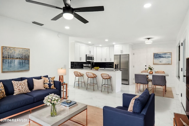 living room with ceiling fan