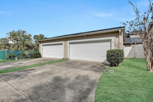 garage featuring a yard